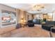 Bright living room featuring large windows with plush carpeting and neutral decor throughout at 3661 Margarita Way, Las Vegas, NV 89103