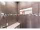 Step-in shower featuring a modern tile design, a shower head and a built-in niche at 3661 Margarita Way, Las Vegas, NV 89103