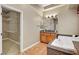 Bathroom featuring vanity, tub, and walk-in closet at 519 Via Garofano Ave, Henderson, NV 89011