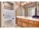 Bathroom featuring vanity, tile floor, and tub with shower at 519 Via Garofano Ave, Henderson, NV 89011