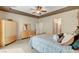 Bedroom featuring a bed, dresser, wardrobe, and decorative pillows at 519 Via Garofano Ave, Henderson, NV 89011