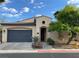 Charming single-story home featuring a well-kept front yard and a two-car garage at 519 Via Garofano Ave, Henderson, NV 89011