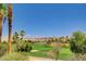 Expansive golf course view with mature trees, manicured greens, and mountain views at 519 Via Garofano Ave, Henderson, NV 89011