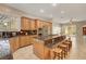 Spacious kitchen with an island, stainless steel appliances, and granite countertops at 519 Via Garofano Ave, Henderson, NV 89011