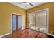 Bright living room with sliding glass door to patio and warm hardwood flooring at 519 Via Garofano Ave, Henderson, NV 89011