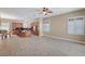 Spacious open-concept living space features large windows, tile floors and neutral decor at 519 Via Garofano Ave, Henderson, NV 89011