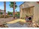 Charming patio with tiled flooring, cozy seating, and well-maintained landscaping at 519 Via Garofano Ave, Henderson, NV 89011