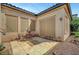 Cozy patio with cafe table and chairs, overlooking professionally landscaped backyard at 519 Via Garofano Ave, Henderson, NV 89011