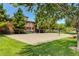 Community sand volleyball court with manicured lawn and mature trees at 519 Via Garofano Ave, Henderson, NV 89011