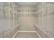 Spacious walk-in closet featuring built-in shelving at 519 Via Garofano Ave, Henderson, NV 89011