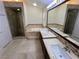 Elegant bathroom with a glass-enclosed shower, soaking tub, and dual sink vanity at 5554 Chicory Falls Ct, Las Vegas, NV 89148
