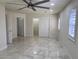 This empty bedroom features tile flooring, recessed lighting, and a sliding-door closet at 5554 Chicory Falls Ct, Las Vegas, NV 89148