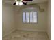 This empty bedroom features tile flooring, recessed lighting, and a window with valance and shutters at 5554 Chicory Falls Ct, Las Vegas, NV 89148