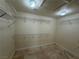 Walk-in closet featuring built-in wire shelving and tile flooring at 5554 Chicory Falls Ct, Las Vegas, NV 89148