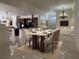 Open-concept dining area features neutral decor and seamlessly connects living spaces at 5554 Chicory Falls Ct, Las Vegas, NV 89148