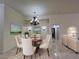 Bright dining room with decor and elegant chandelier at 5554 Chicory Falls Ct, Las Vegas, NV 89148