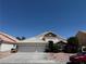 Charming single-story home featuring a three-car garage and desert landscaping at 5554 Chicory Falls Ct, Las Vegas, NV 89148