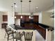 Bright kitchen with a center island, granite countertops, stylish pendant lighting, and stainless steel appliances at 5554 Chicory Falls Ct, Las Vegas, NV 89148