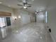 Spacious living room with tile floors, ceiling fans and natural light from windows and doors at 5554 Chicory Falls Ct, Las Vegas, NV 89148