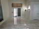 Bright living room featuring tile floors, recessed lighting, and access to the backyard at 5554 Chicory Falls Ct, Las Vegas, NV 89148