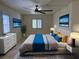 This spacious bedroom is bright and features a ceiling fan, recessed lighting, and a decorative rug at 5554 Chicory Falls Ct, Las Vegas, NV 89148