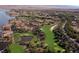 Picturesque aerial view of the community, golf course, and lake at 59 Desert Ivy Ln, Henderson, NV 89011