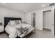 Calm bedroom featuring a comfortable bed, soft lighting, and access to ensuite bathroom at 59 Desert Ivy Ln, Henderson, NV 89011