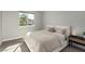 Well-lit bedroom boasts soft carpet, and a neutral color palette that offers a calm and relaxing atmosphere at 59 Desert Ivy Ln, Henderson, NV 89011