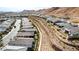 An aerial view of the community with manicured landscaping and hillside backdrop at 59 Desert Ivy Ln, Henderson, NV 89011