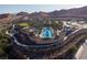 Enjoy this luxury community pool surrounded by a desert landscape with a walking path at 59 Desert Ivy Ln, Henderson, NV 89011