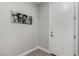 Entryway with sleek tile flooring, modern baseboards and an artistic print hanging above at 59 Desert Ivy Ln, Henderson, NV 89011