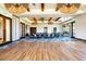 Large event space with wooden floors, tables and chairs, and modern light fixtures at 59 Desert Ivy Ln, Henderson, NV 89011