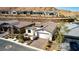 Lovely single-story home with a brick driveway, beautiful landscaping, and attached garage at 59 Desert Ivy Ln, Henderson, NV 89011