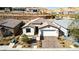 Charming single-story home with a brick driveway and meticulously maintained landscaping at 59 Desert Ivy Ln, Henderson, NV 89011