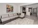 Relaxing living room featuring modern furnishings and an open layout that connects to the gourmet kitchen at 59 Desert Ivy Ln, Henderson, NV 89011