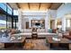 Stylish living area with modern sofas, custom coffee tables, and a wet bar creating an inviting space at 59 Desert Ivy Ln, Henderson, NV 89011