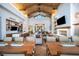 Open concept living space with a dining table, modern kitchen, and comfortable seating at 59 Desert Ivy Ln, Henderson, NV 89011