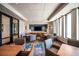 Inviting lounge area featuring stylish seating, a wall-mounted TV, and modern decor at 59 Desert Ivy Ln, Henderson, NV 89011