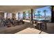 Outdoor poolside lounge with palm trees and lounge seating offers a serene and upscale recreation space at 59 Desert Ivy Ln, Henderson, NV 89011