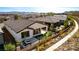 Stunning rear view featuring a cozy patio, lush landscaping, and elegant hardscaping at 59 Desert Ivy Ln, Henderson, NV 89011