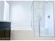Contemporary bathroom featuring a glass shower, tub, and tiled walls at 600 N Carriage Hill Dr # 1019, Las Vegas, NV 89138