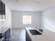Well-lit kitchen featuring an island sink, quartz countertops and hardwood floors at 600 N Carriage Hill Dr # 1019, Las Vegas, NV 89138