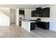 Open concept kitchen with stainless appliances, island and seamless flow into the living area at 600 N Carriage Hill Dr # 1019, Las Vegas, NV 89138