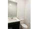 Modern powder room featuring a vanity with countertop sink and a toilet at 600 N Carriage Hill Dr # 1019, Las Vegas, NV 89138