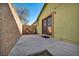 Cozy backyard patio space with double doors and seating area at 6520 Ouida Way, Las Vegas, NV 89108