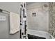 The renovated bath features a shower over tub and designer tile work at 6520 Ouida Way, Las Vegas, NV 89108