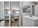 Bathroom with a mirror over the vanity and a view of the bedroom at 6520 Ouida Way, Las Vegas, NV 89108