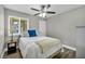 This bedroom features a ceiling fan and lots of natural light at 6520 Ouida Way, Las Vegas, NV 89108
