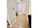 Hallway offering neutral wall colors, tiled floors, and doors leading to rooms at 6819 Mahogany Meadows Ave, Las Vegas, NV 89122