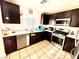 Beautiful kitchen with stainless steel appliances, modern cabinets, and tiled flooring at 6819 Mahogany Meadows Ave, Las Vegas, NV 89122